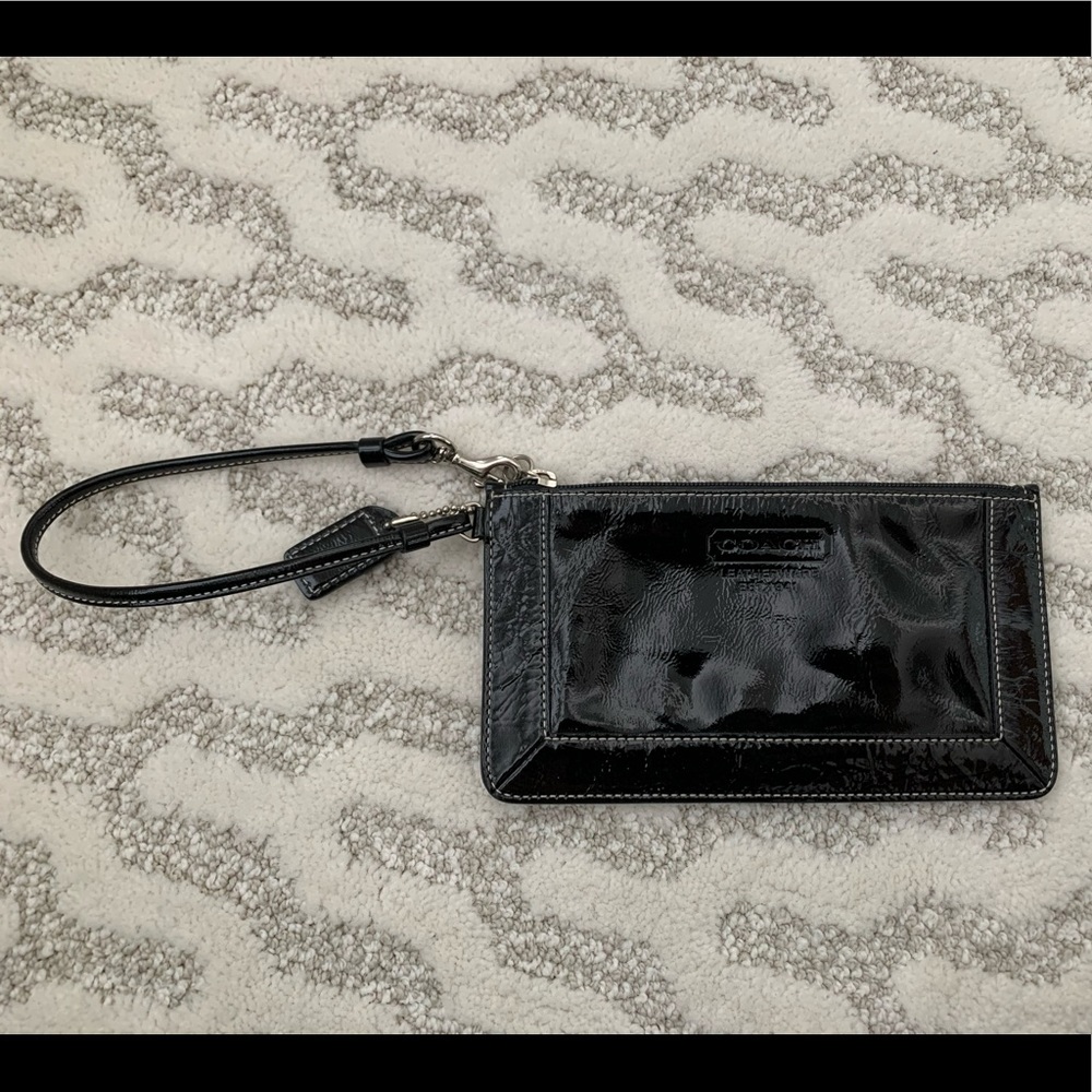 Black patent leather Coach wristlet with strap